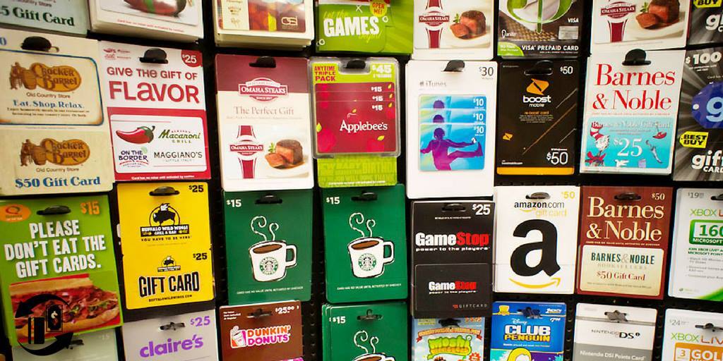 A store display rack of gift cards from brands including Applebee’s, GameStop and Amazon.