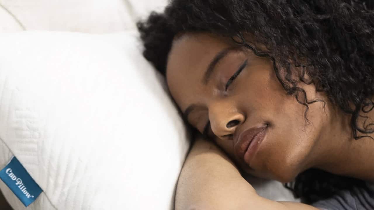 woman-sleeping-on-a-cbd-pillow