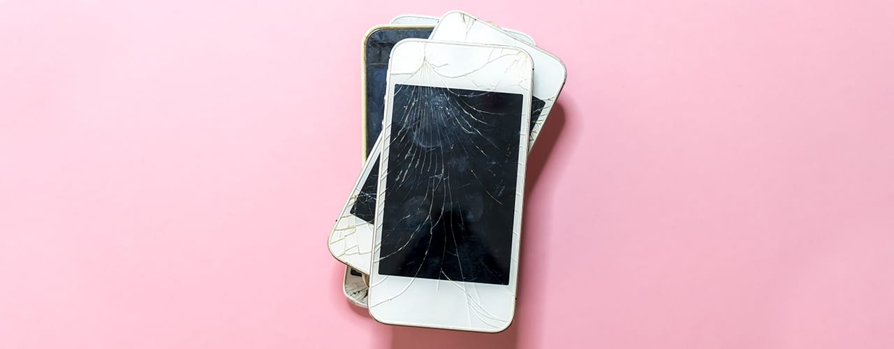 broken iphones recycle pink background inbody