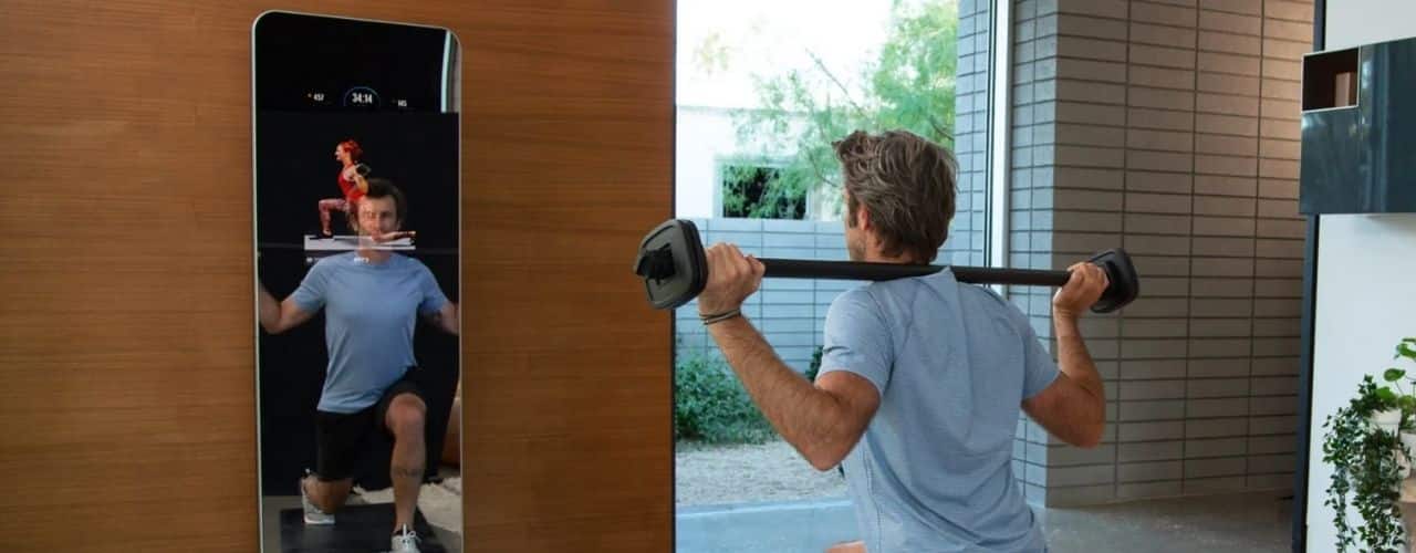 man lifting weight using ProForm Vue mirror