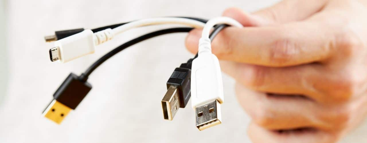 Person holding stack of a different electric wires