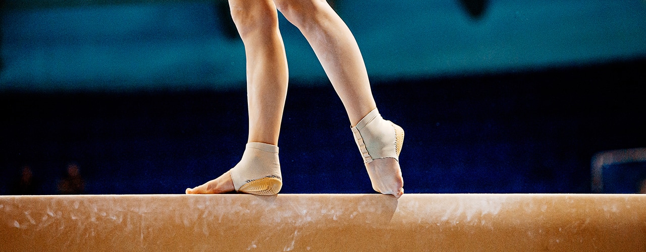 Legs women balance beam gymnastics