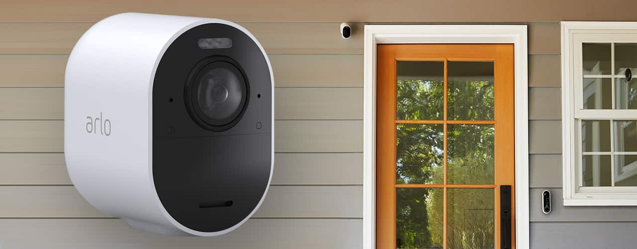 arlo ultra 2 camera for outside your home product shot on on sunny day on side of house background