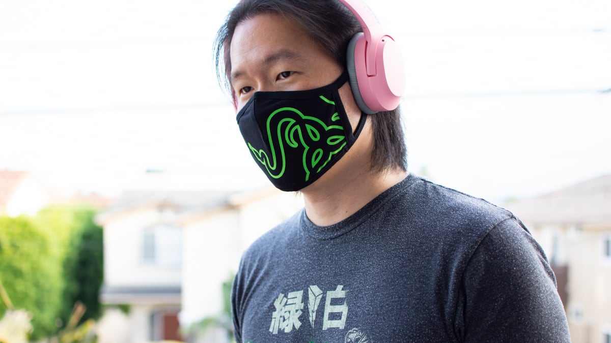 person wearing razer quartz opus x headphones outdoors