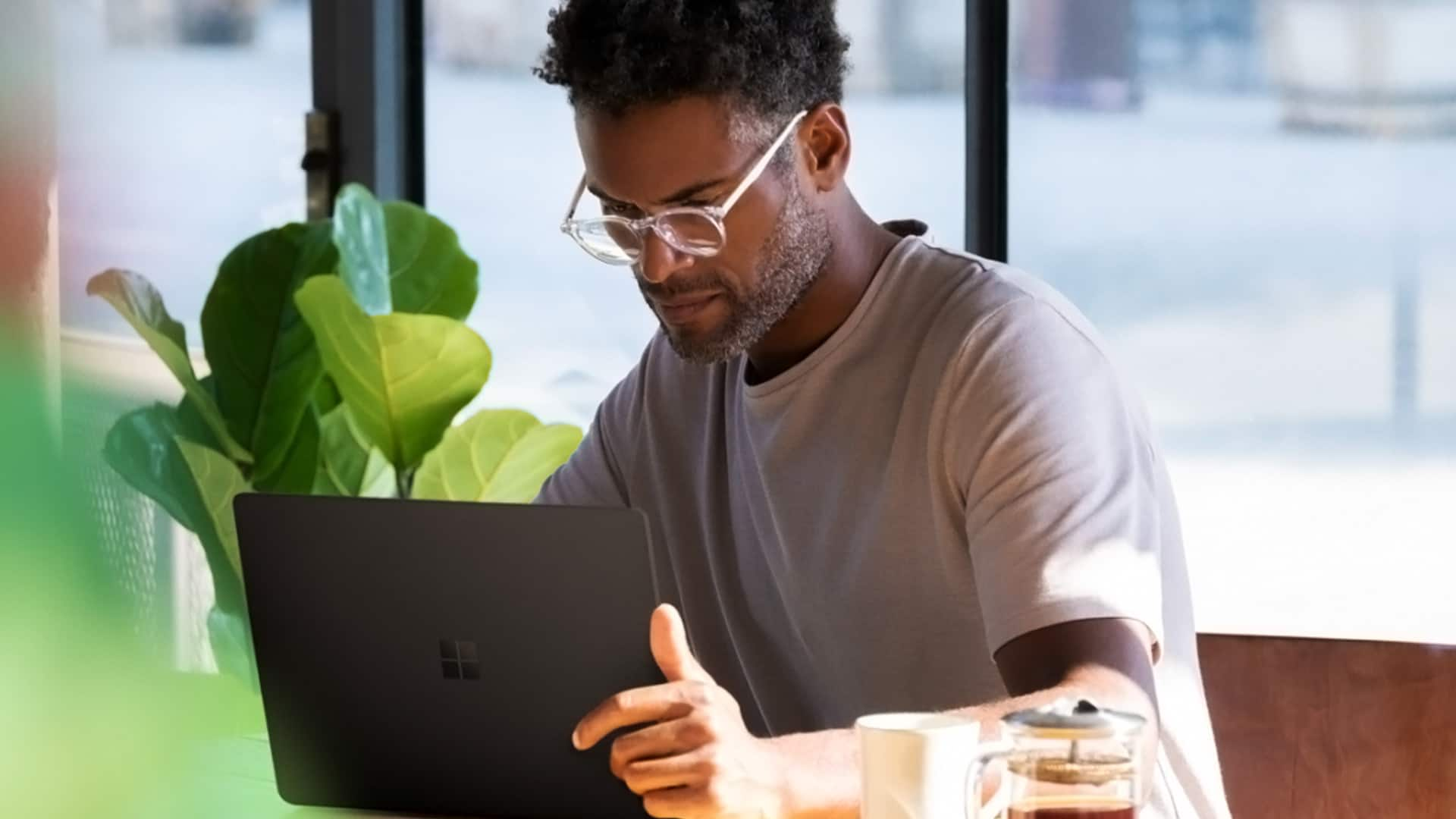 Man on Microsoft Laptop Computer