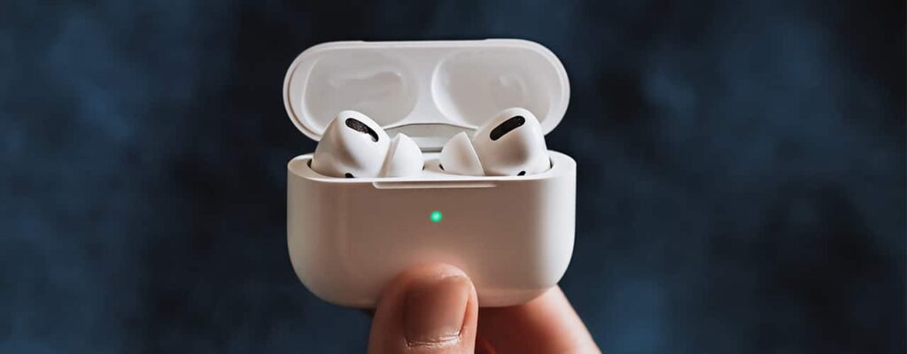 hand holding airpod charging case