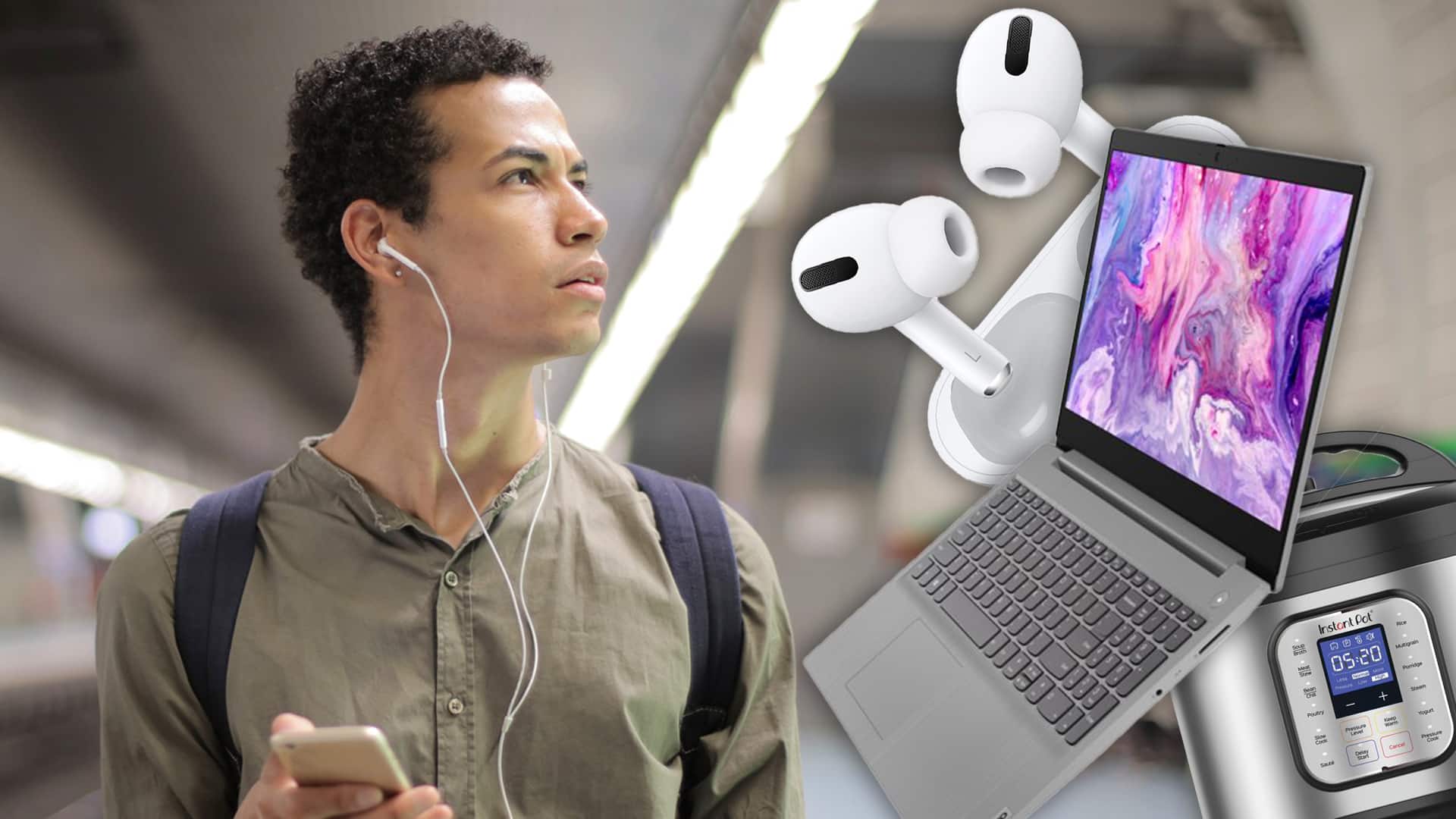 man wearing headphones looking at tech products