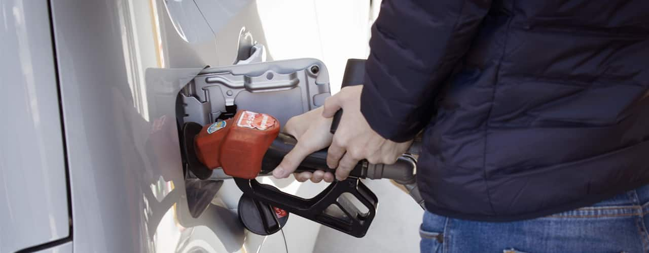 man pumping gas