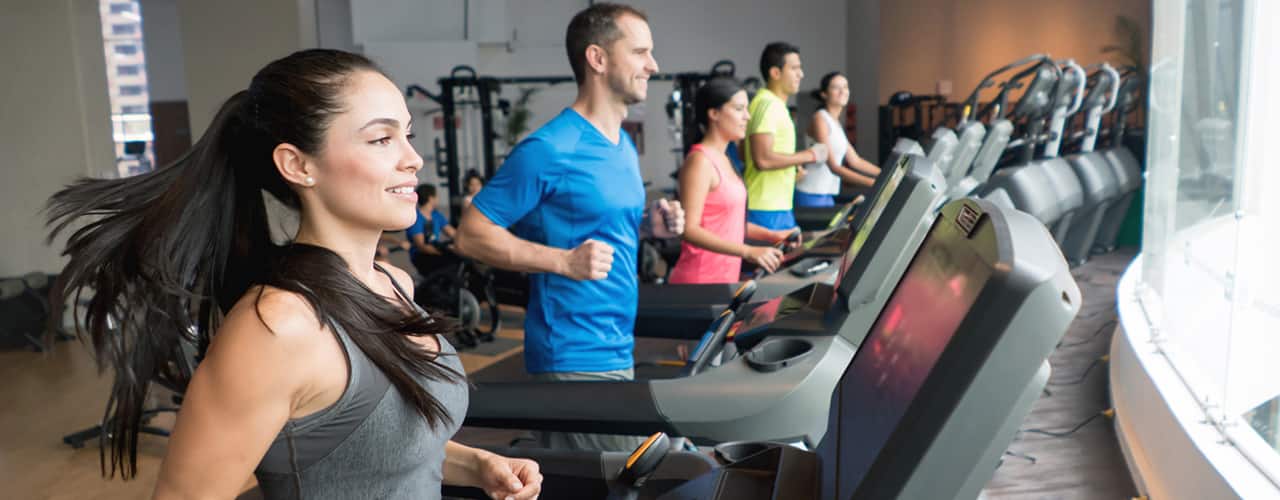 people on treadmills at gym