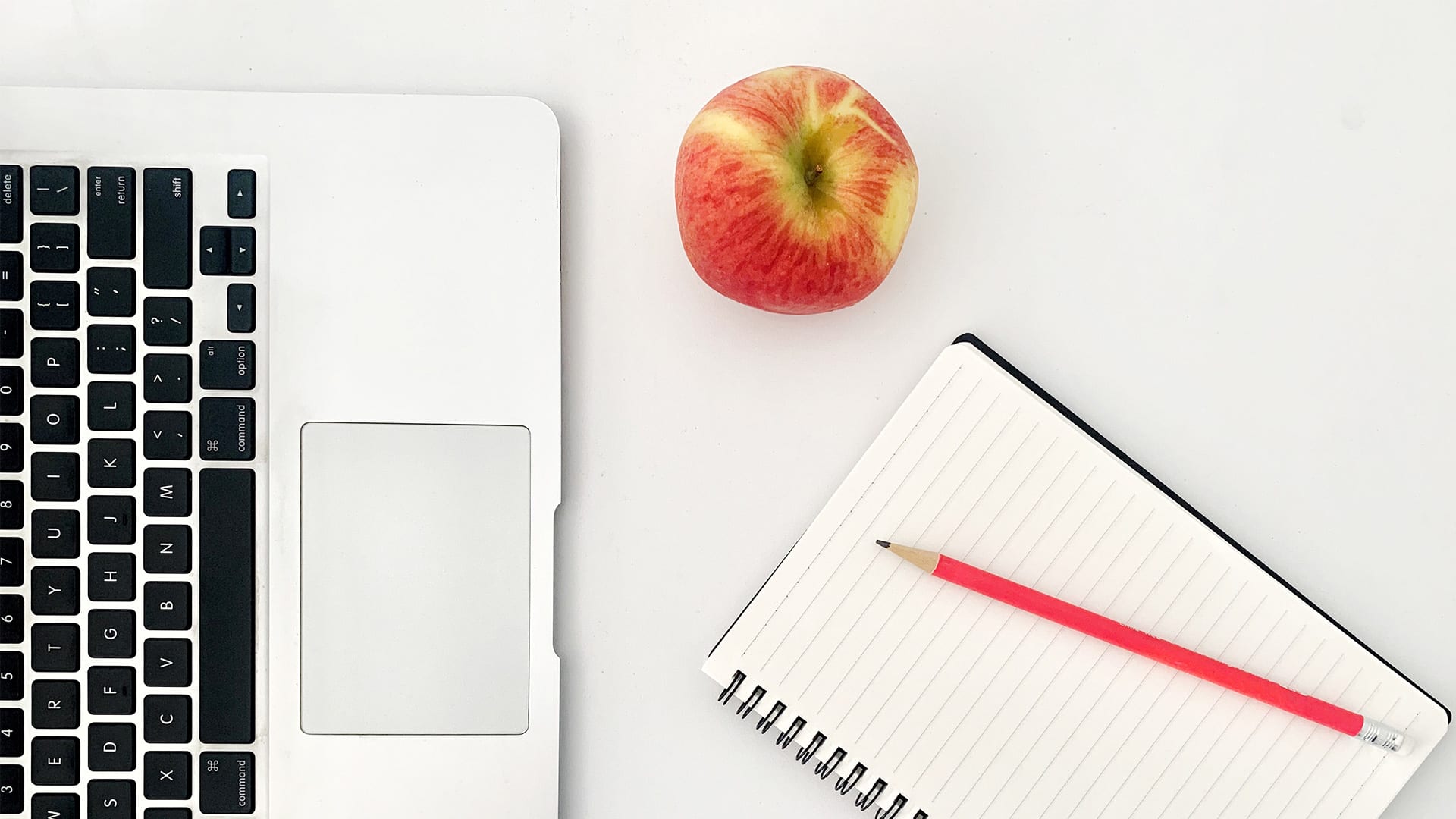 apple and notebook near macbook