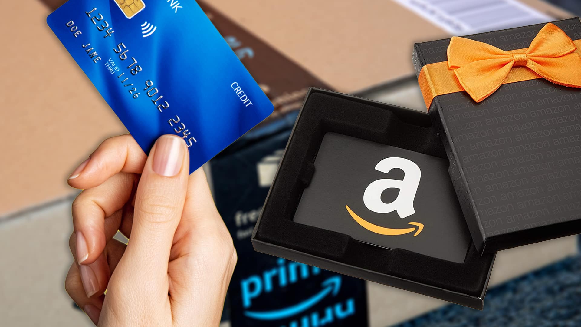 hand with credit card and gift card over amazon box