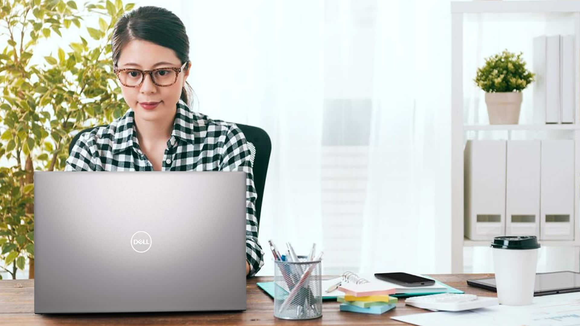 Girl at Desk on Dell Laptop Computer