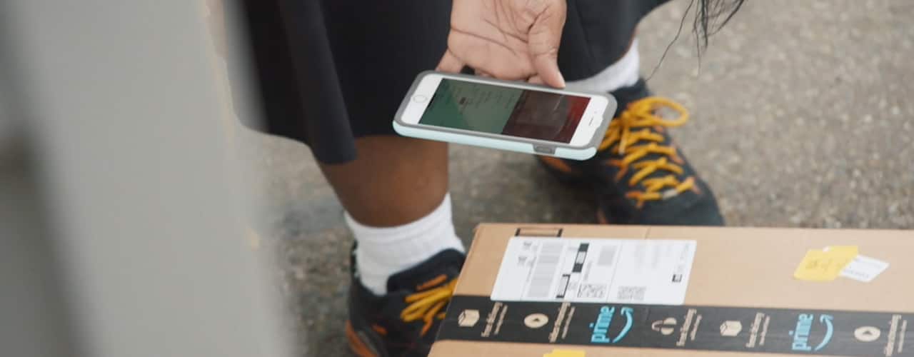 amazon delivery person scanning package