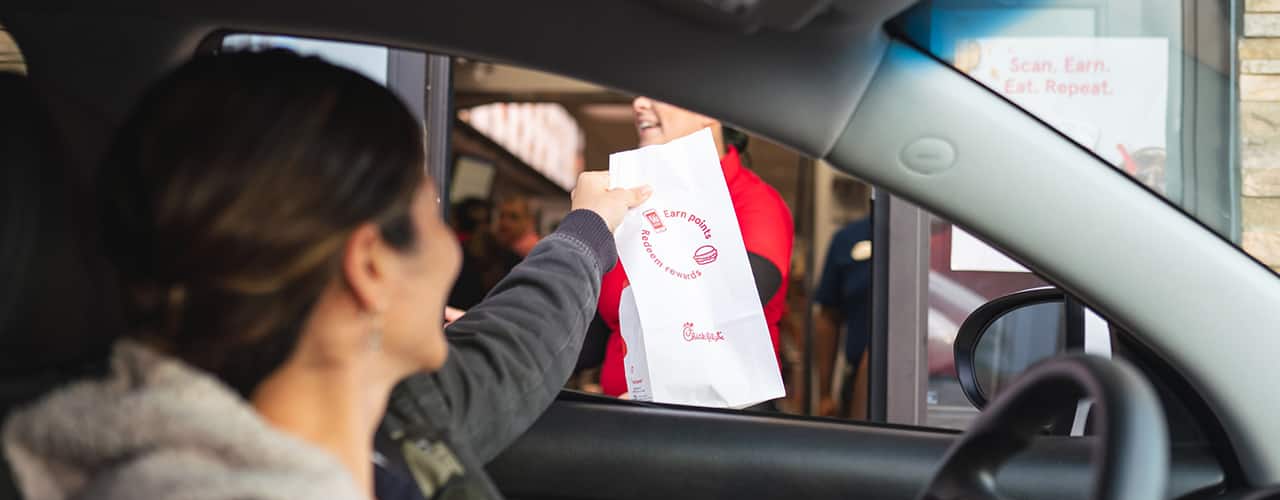 person using Chick-fil-A drive thru