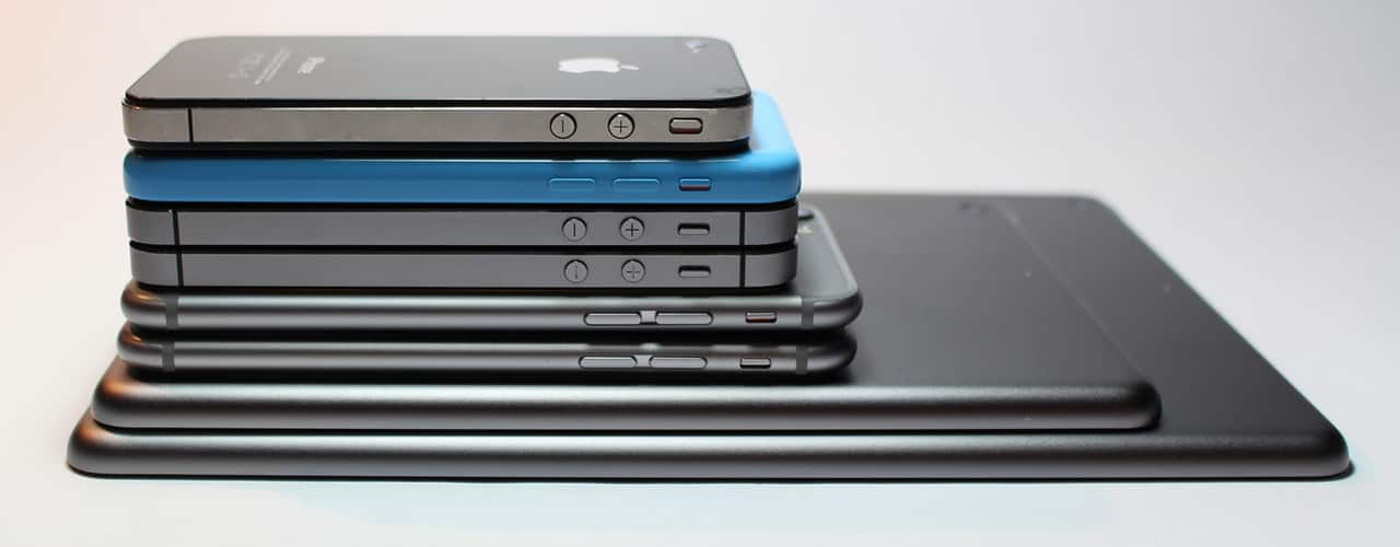 pile of used apple devices