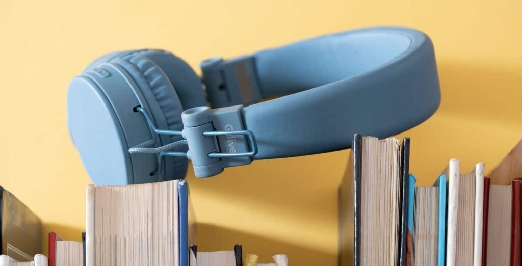 headphones on top of books