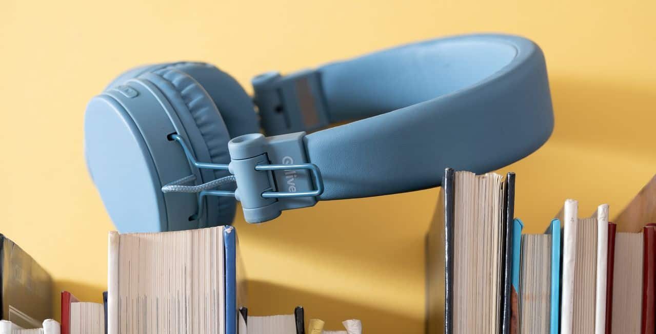 headphones on top of books