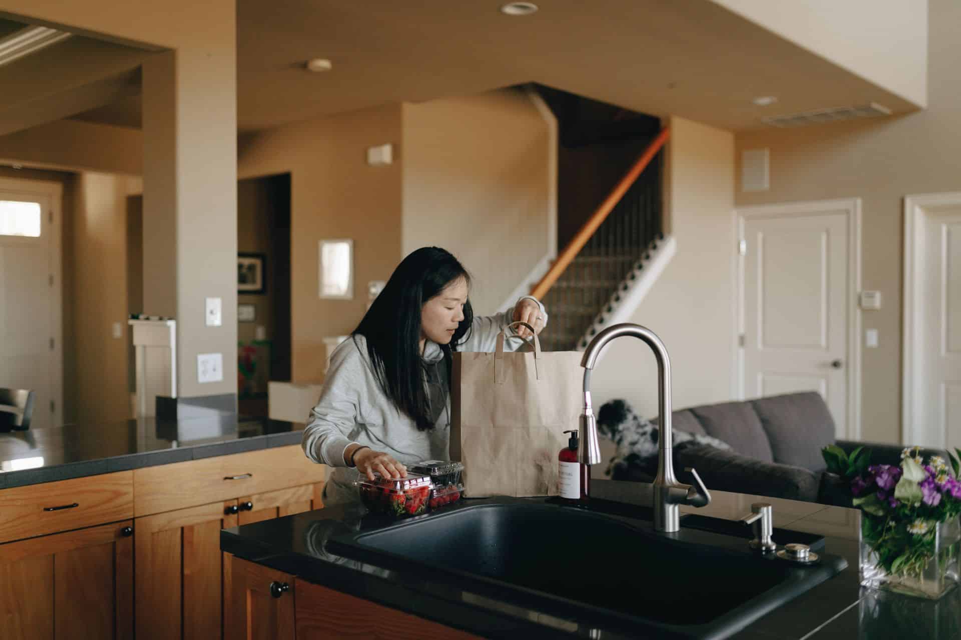 Woman unpacking groceries