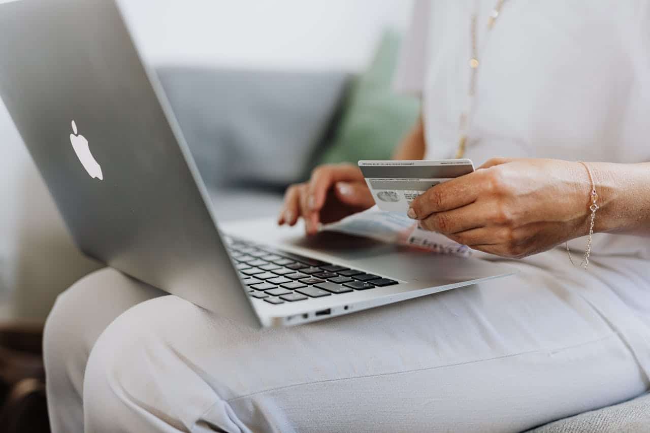 A person shopping online using their laptop