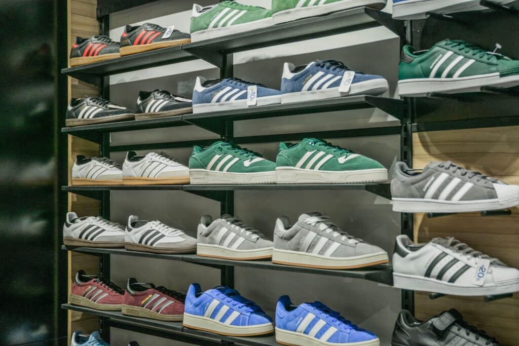 Rows of sneakers on display at a JD Sports store