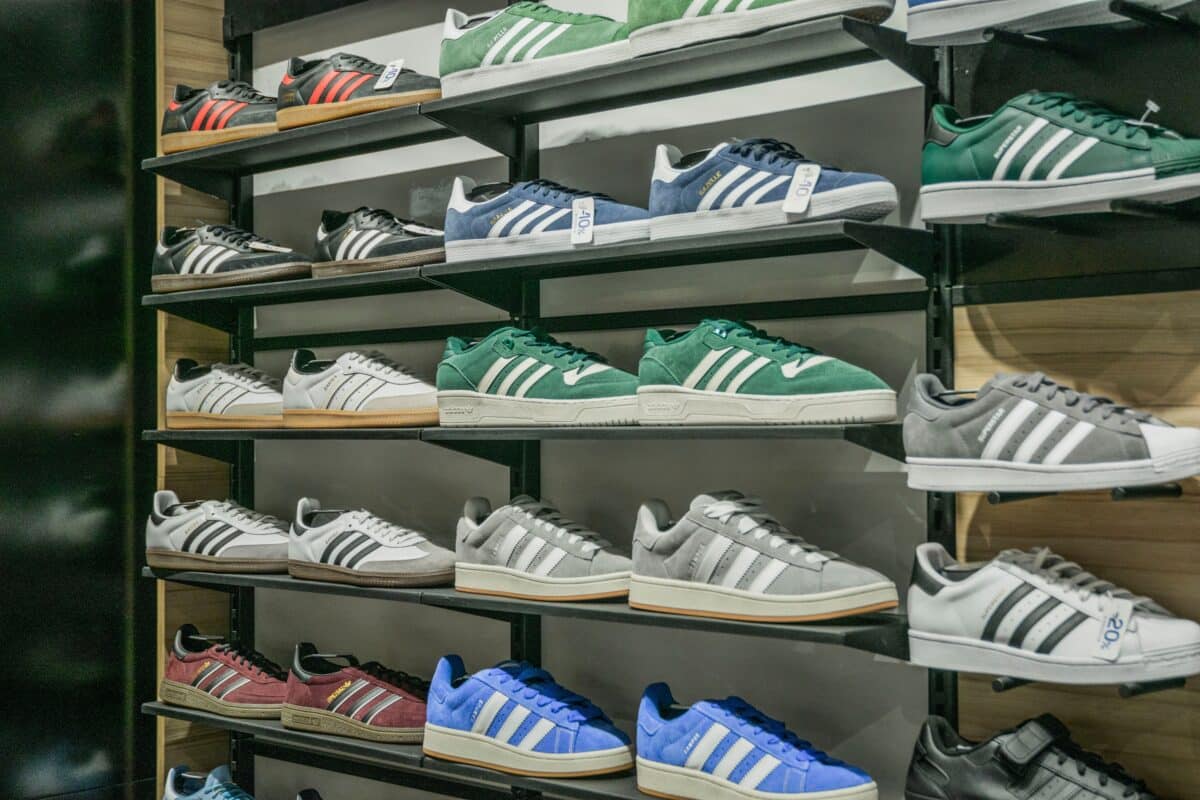 Rows of sneakers on display at a JD Sports store